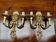 Pair of solid gilded bronze wall lights.