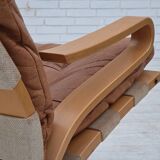 Fauteuil norvégien des années 1970, modèle "Kengu", cuir de meuble.