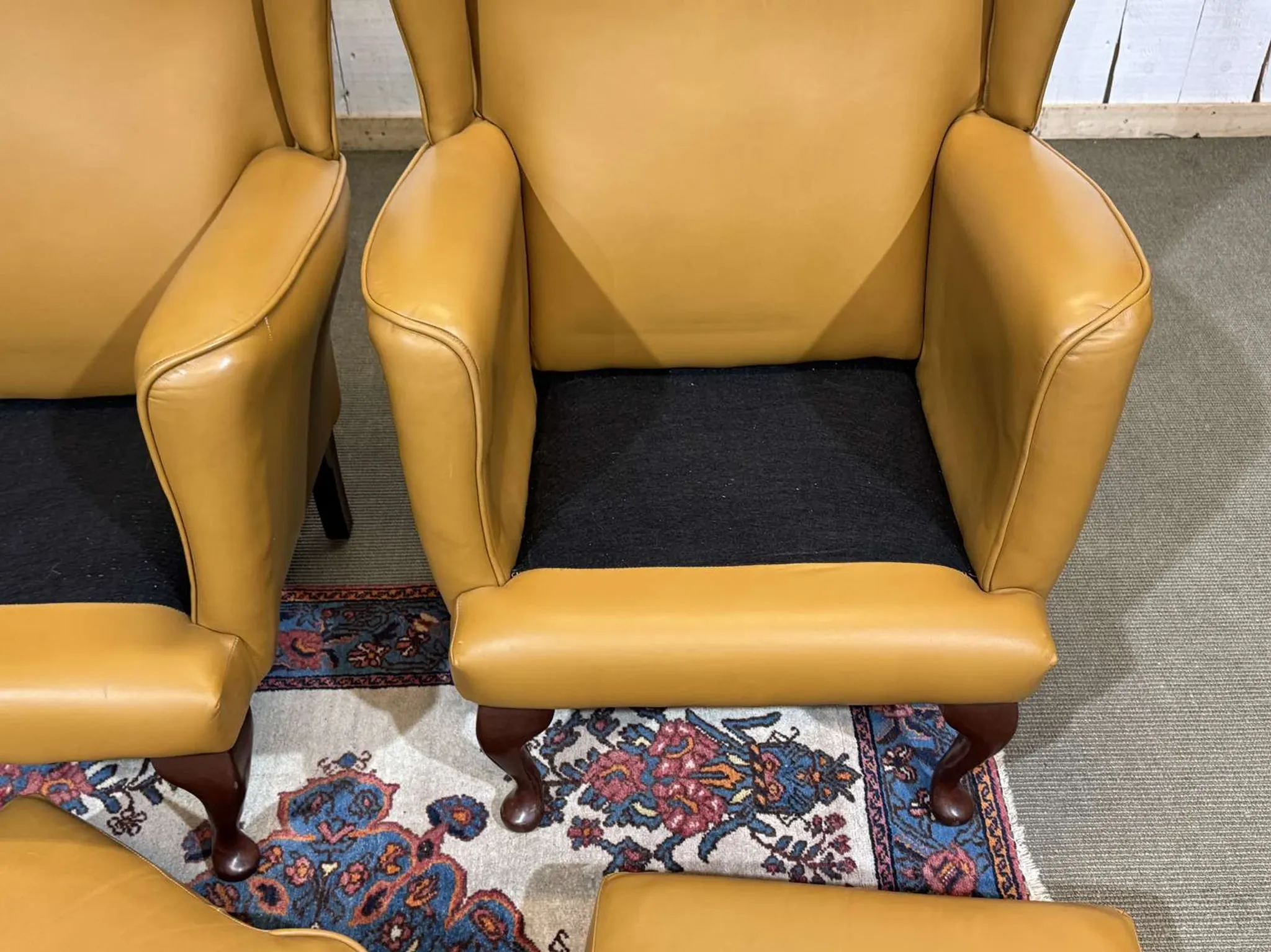 Pair of 1980s English wingback armchairs in leather.