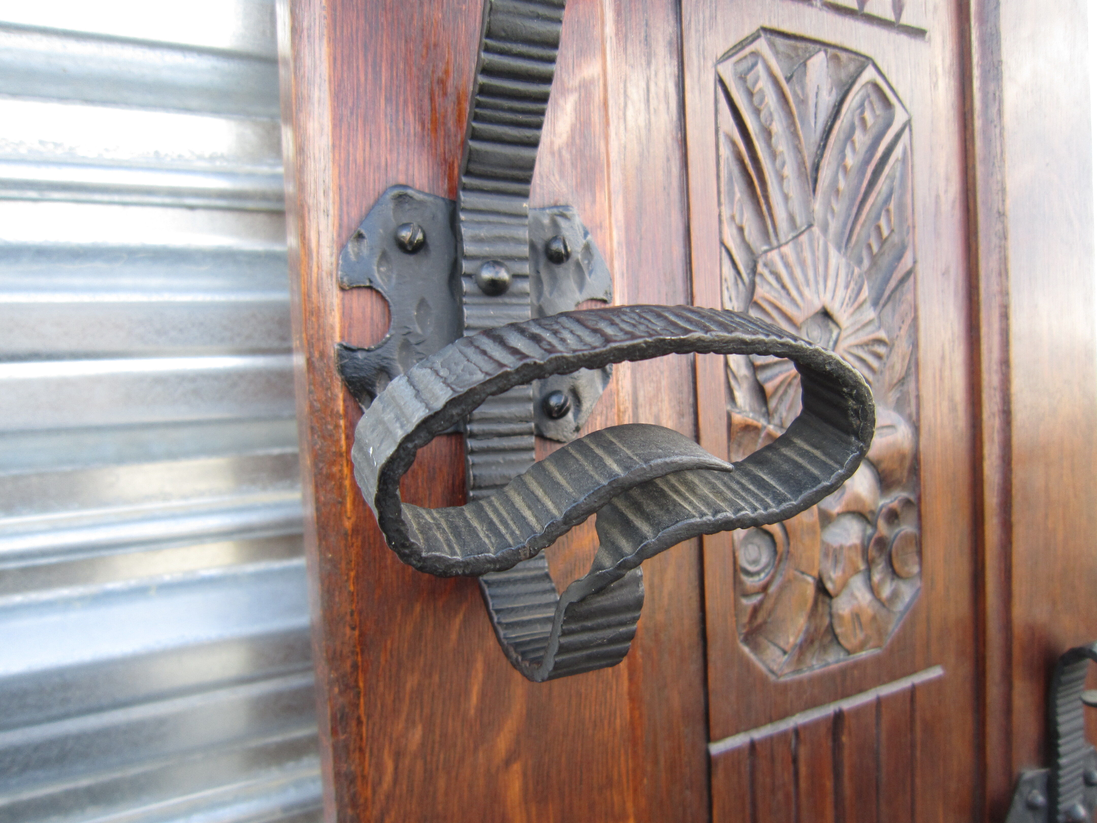 Vestiaire wears hat coat and art deco umbrella in wrought iron patere wood