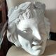 Old face in plaster antique decoration