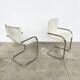 Pair of white moulded shell chairs with chrome tube — Space Age 70s