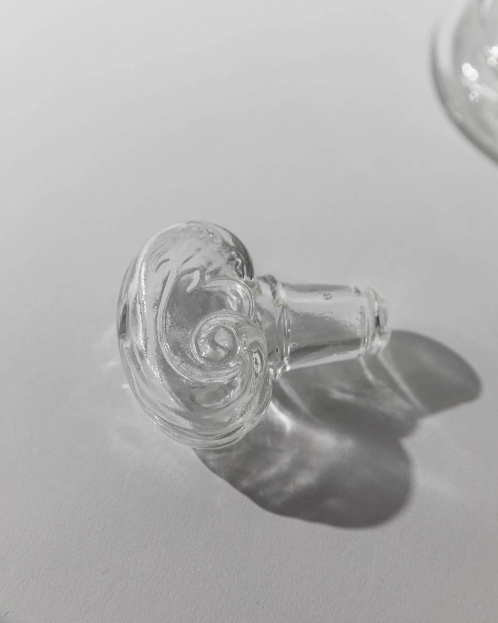 Vintage pressed glass carafe from the 1960s, clear sculptural glass with textured patterns and a stopper.