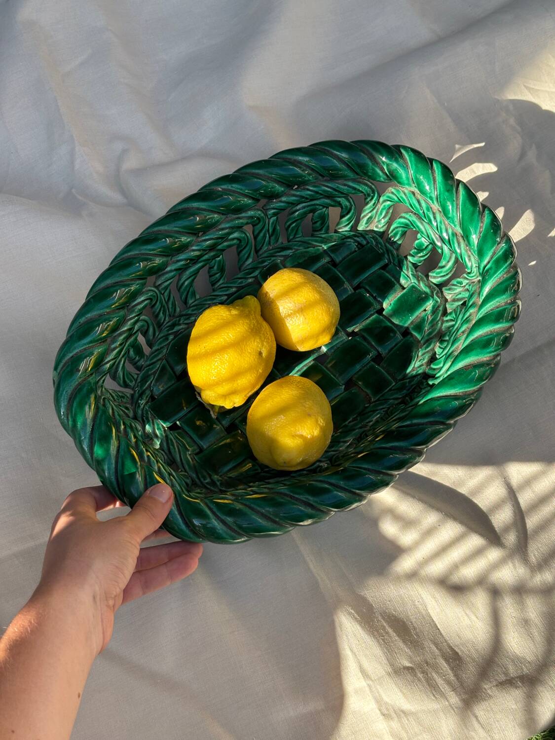 Green woven ceramic basket