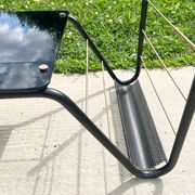 Metal and glass coffee table with magazine rack by Roche Bobois from the 1950s.