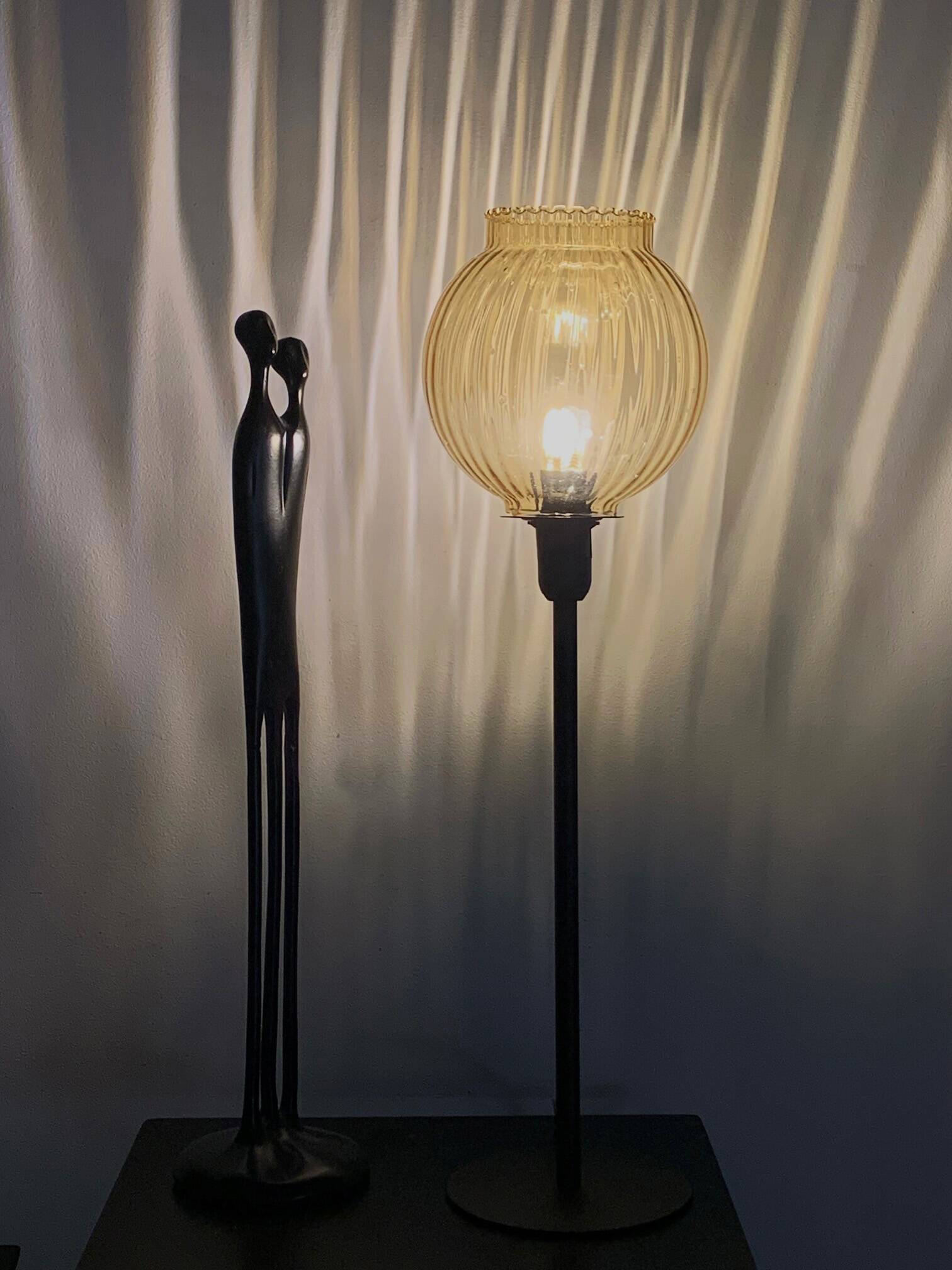 Table lamp with an antique gold glass lampshade