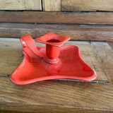 Red enamelled sheet metal candle holder
