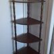 Corner shelf on wooden legs