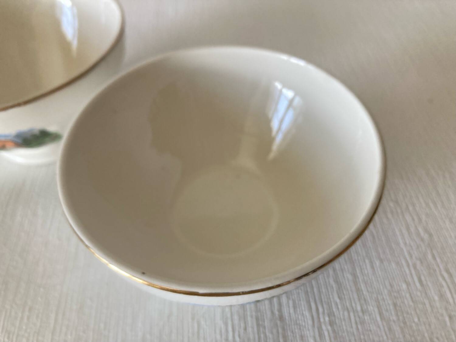 Pair of small faceted bowls with cow illustrations from the 40s and 50s