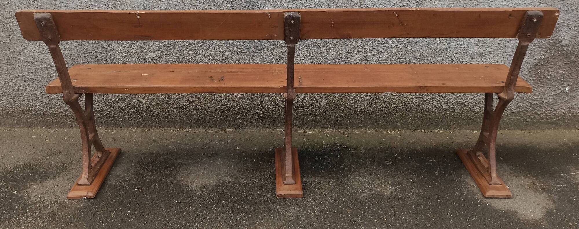Old wooden bench with cast iron base