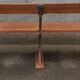 Old wooden bench with cast iron base