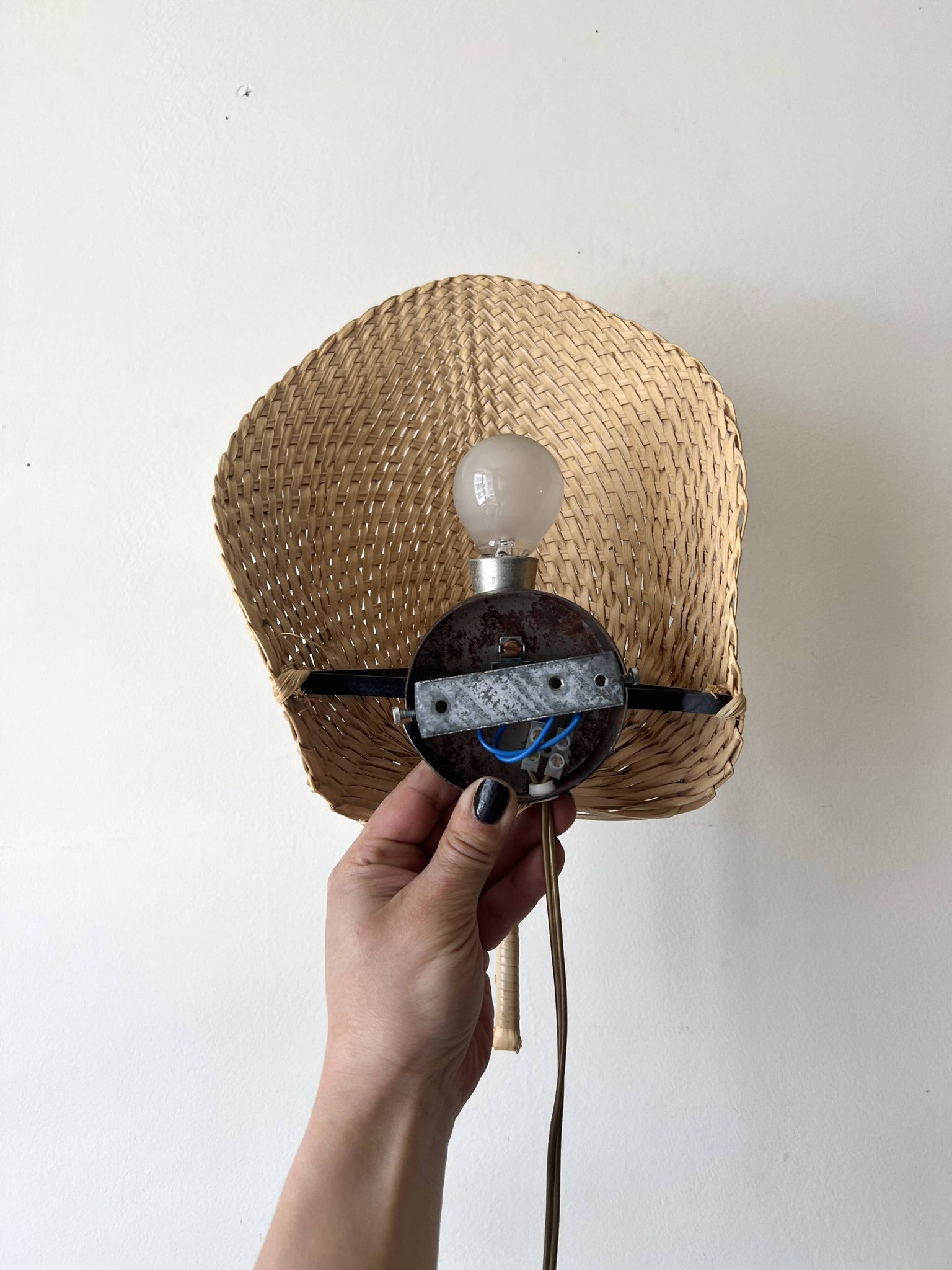 Woven rattan wall light in the style of Igno Maurer, design from the 1970s.