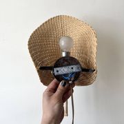 Woven rattan wall light in the style of Igno Maurer, design from the 1970s.