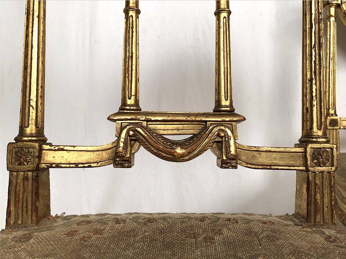 Series of three Louis XVI style chairs in gilded wood, circa 1900