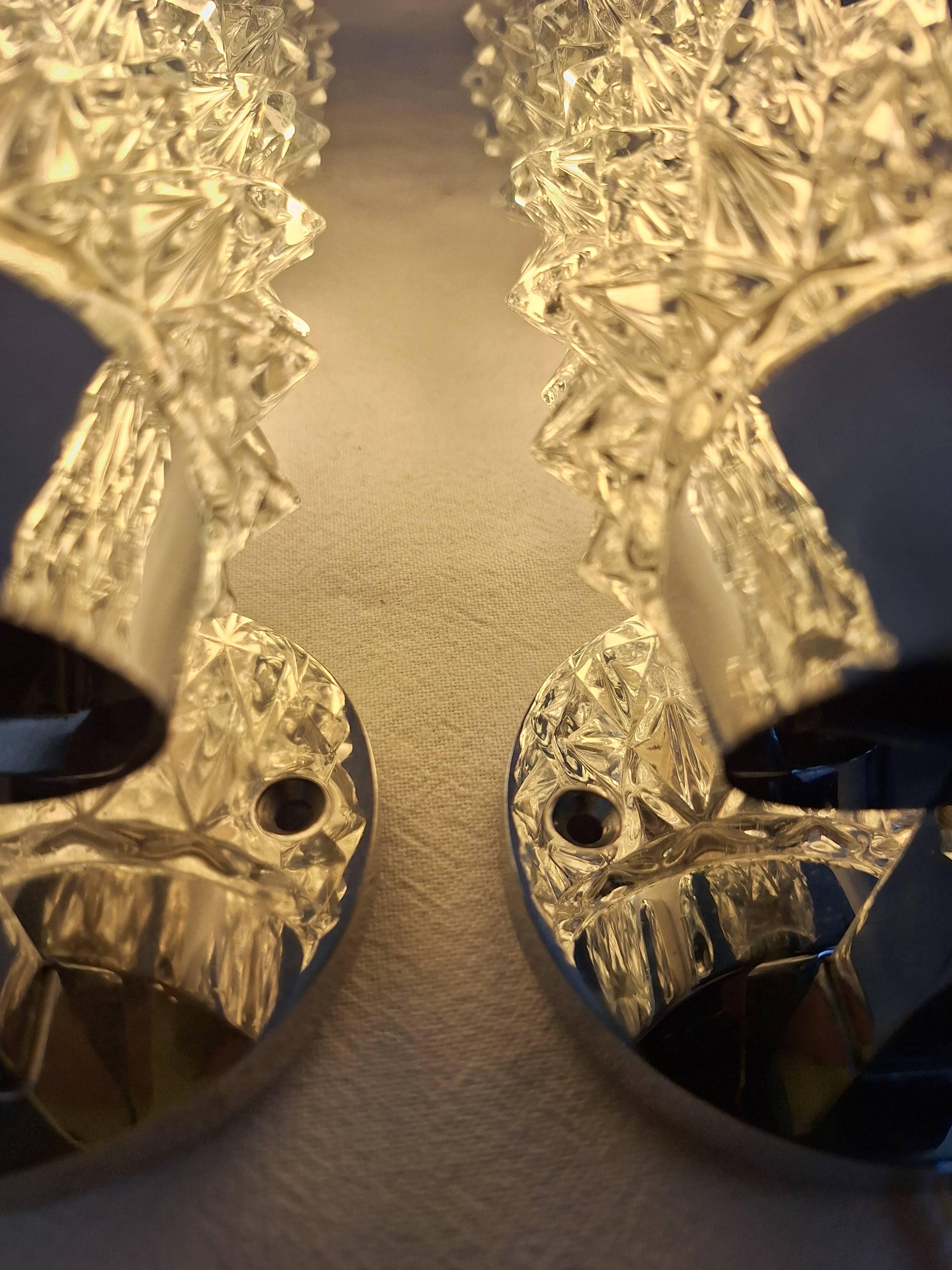 Pair of vintage space age chrome and molded glass wall lights, bedside night light