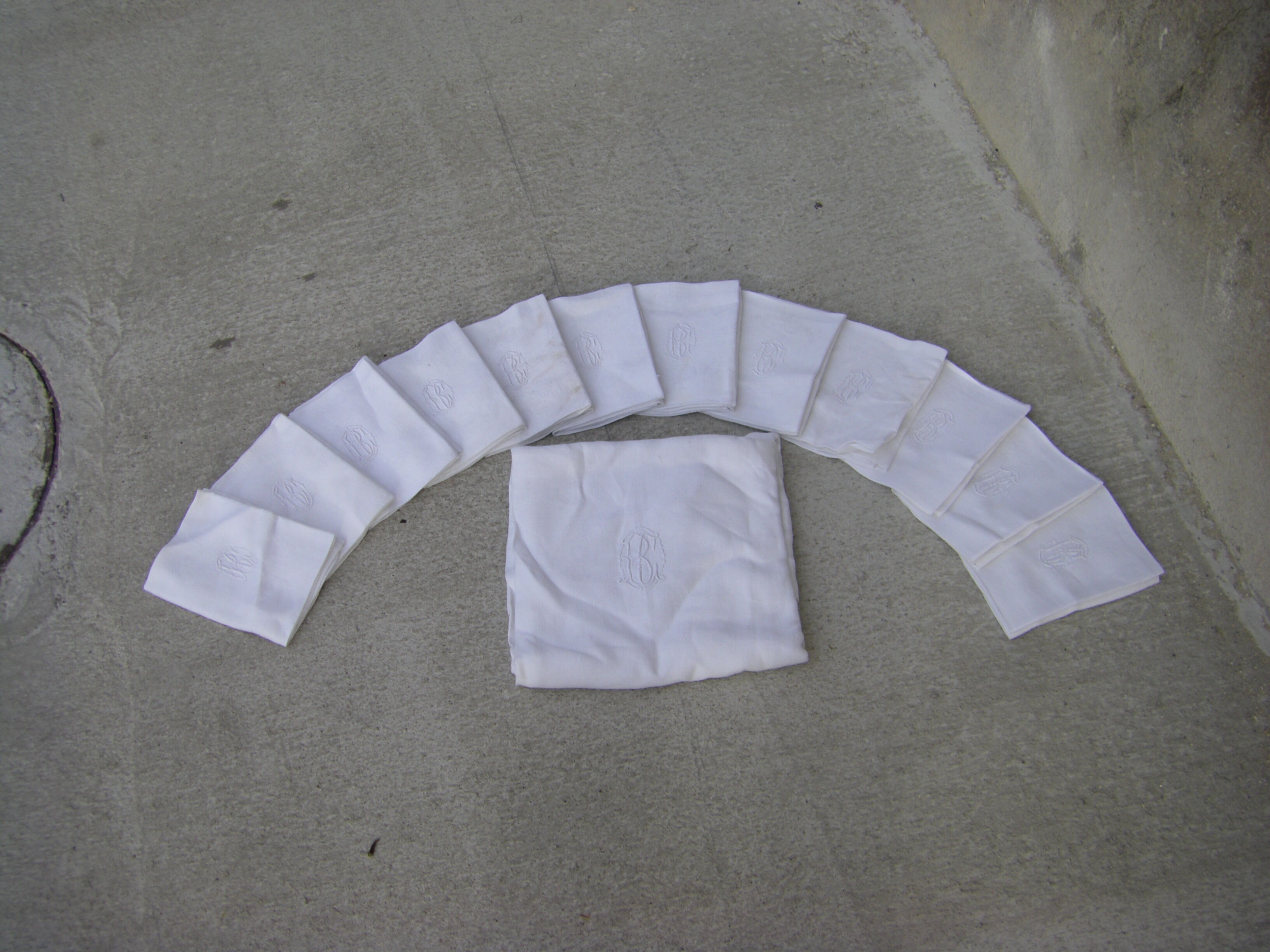 Tablecloth and its twelve monogrammed towels.