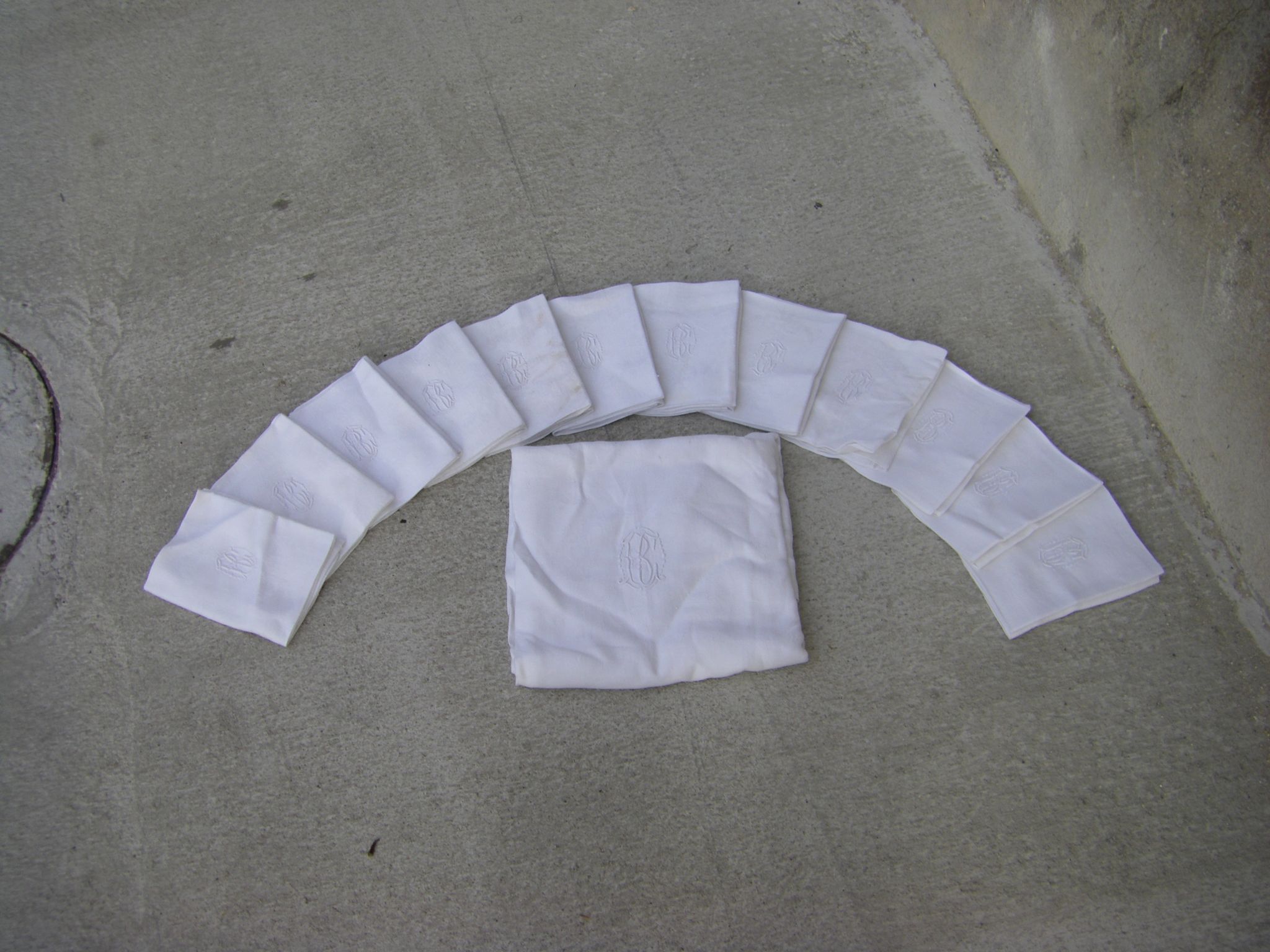 Tablecloth and its twelve monogrammed towels.