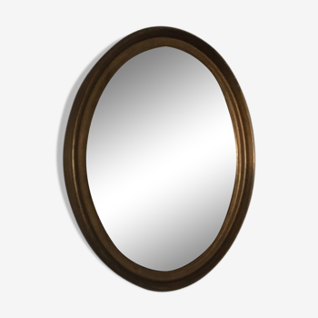 Miroir ovale en bois doré