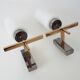 Pair of chrome-plated metal and opaline brass wall lights. 1960s