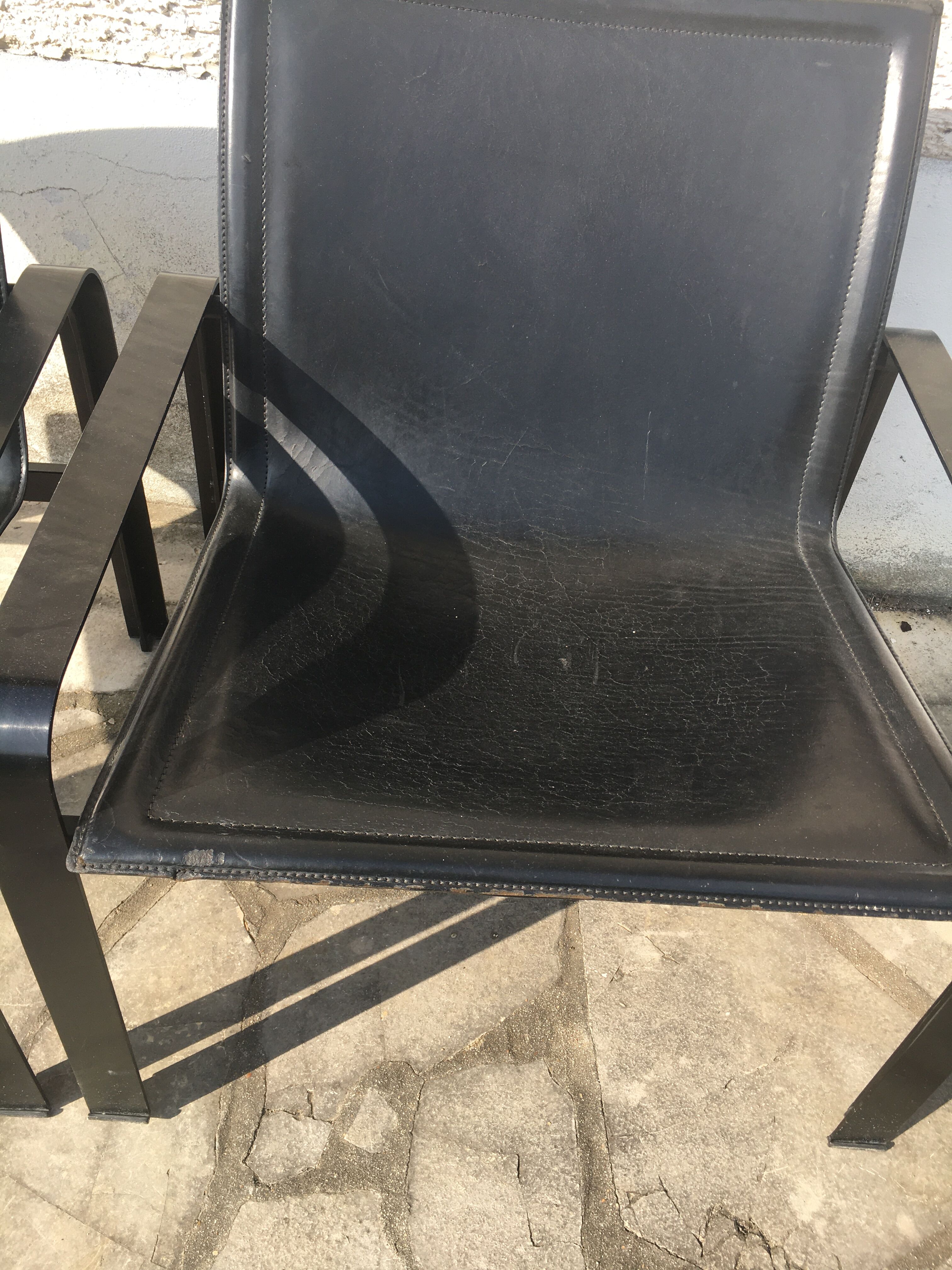 Pair of leather and metal chairs 70s