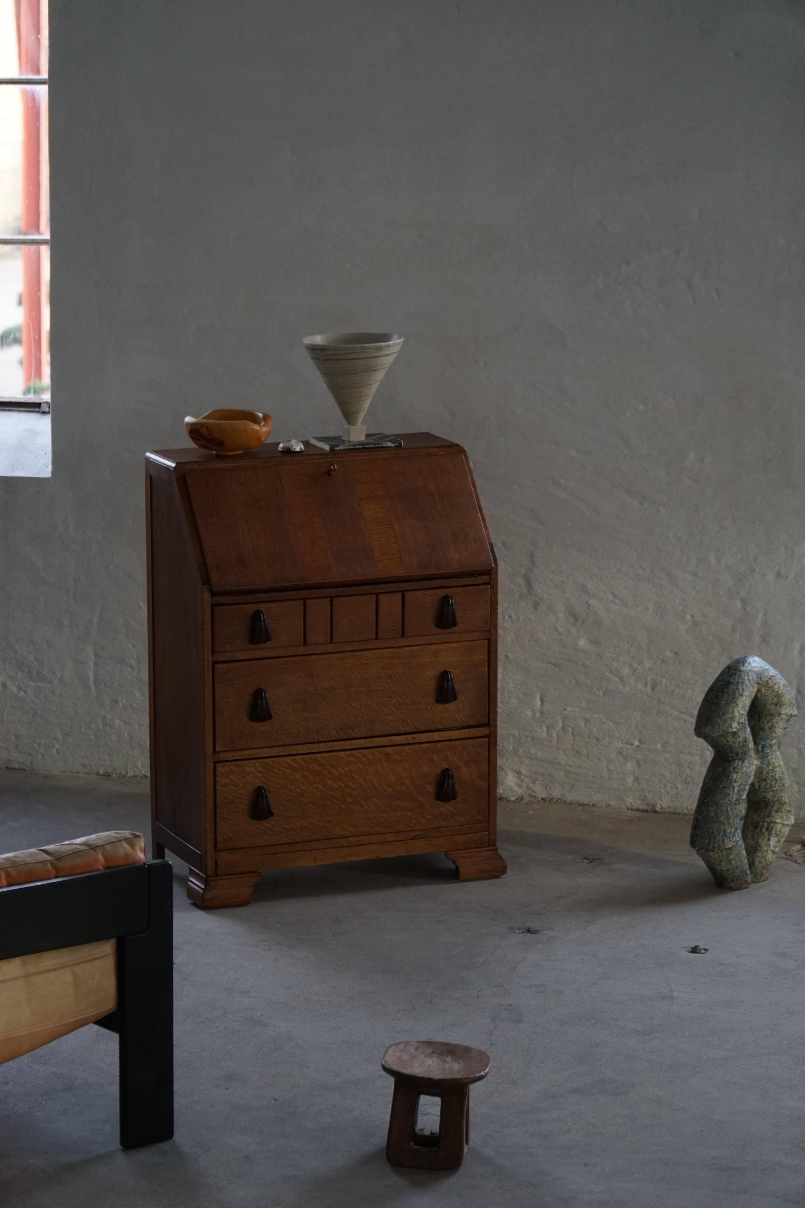 Desk / Chest of drawers in modern Danish oak from the early 20th century with shell handles.
