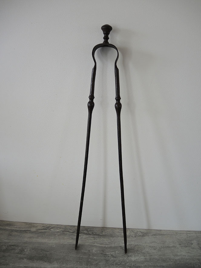 Old wrought iron fireplace clamp