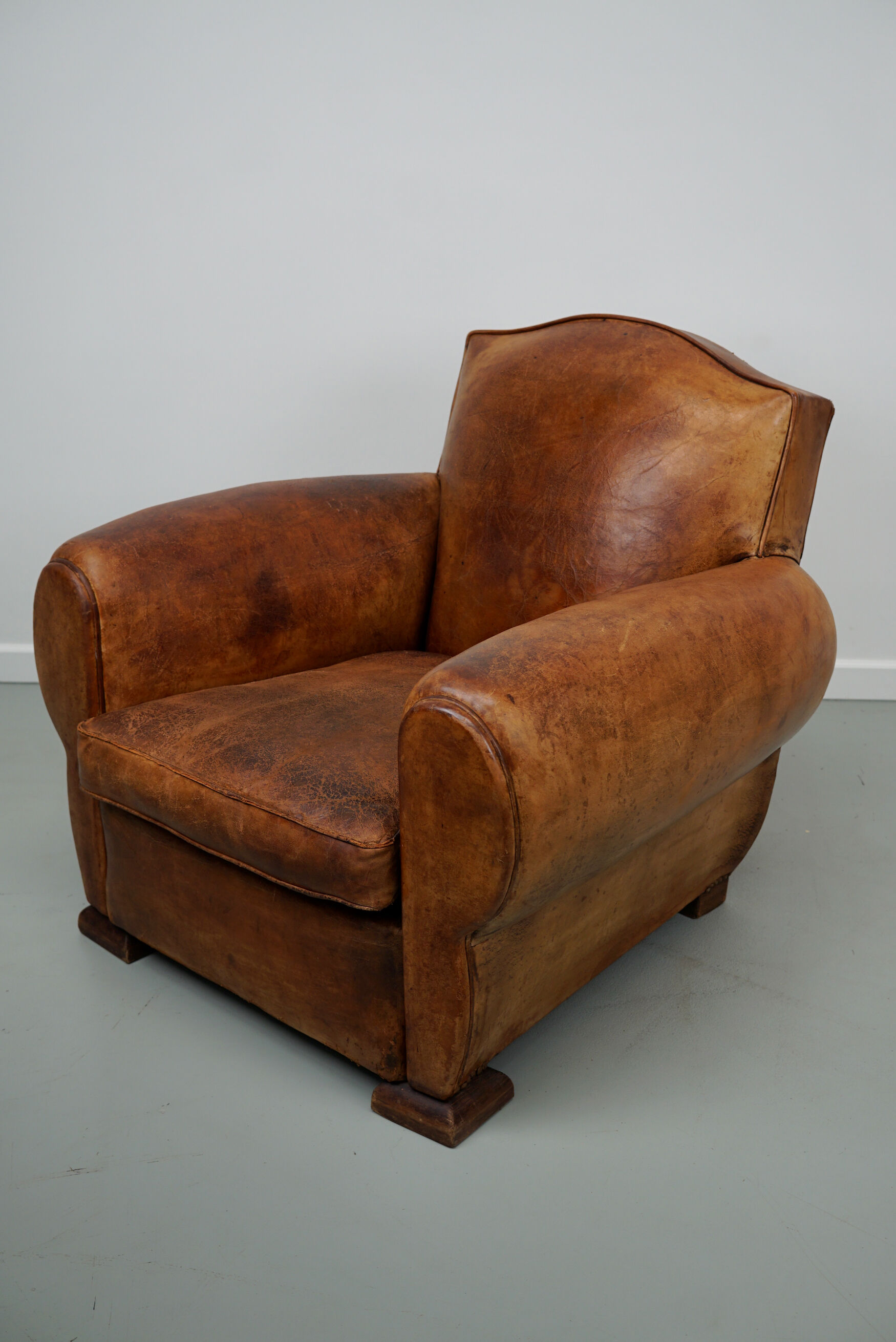 French moustache back cognac-colored leather club chair, 1940s
