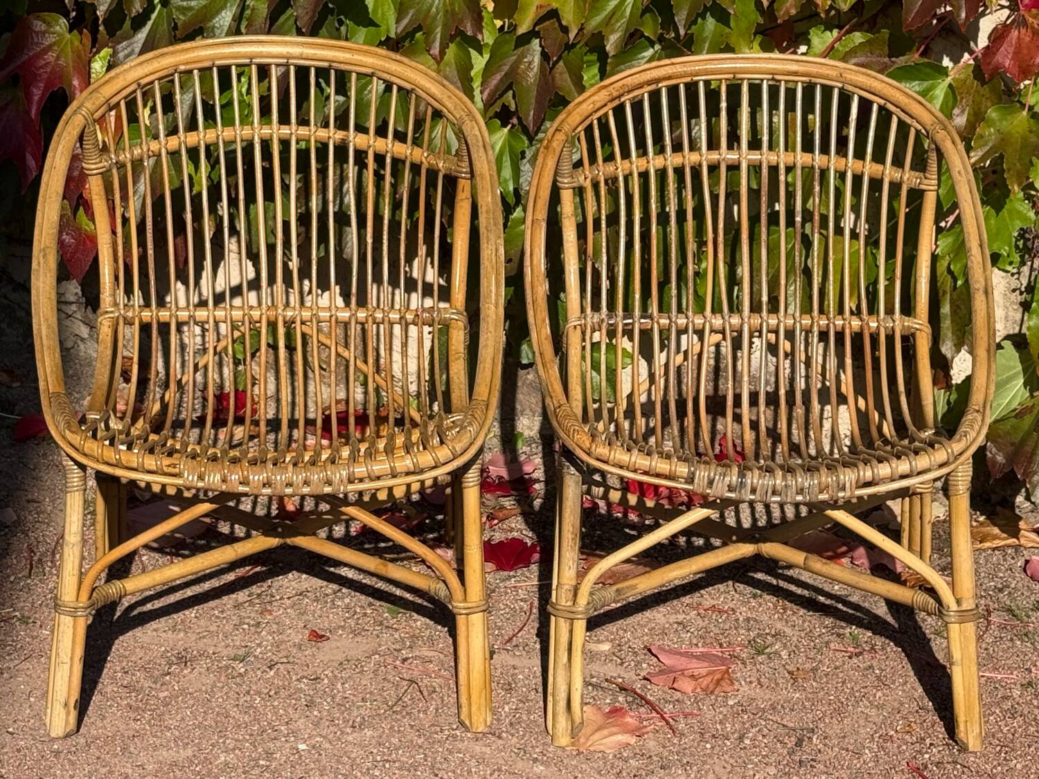 Pair of 1950s rattan armchairs from France.