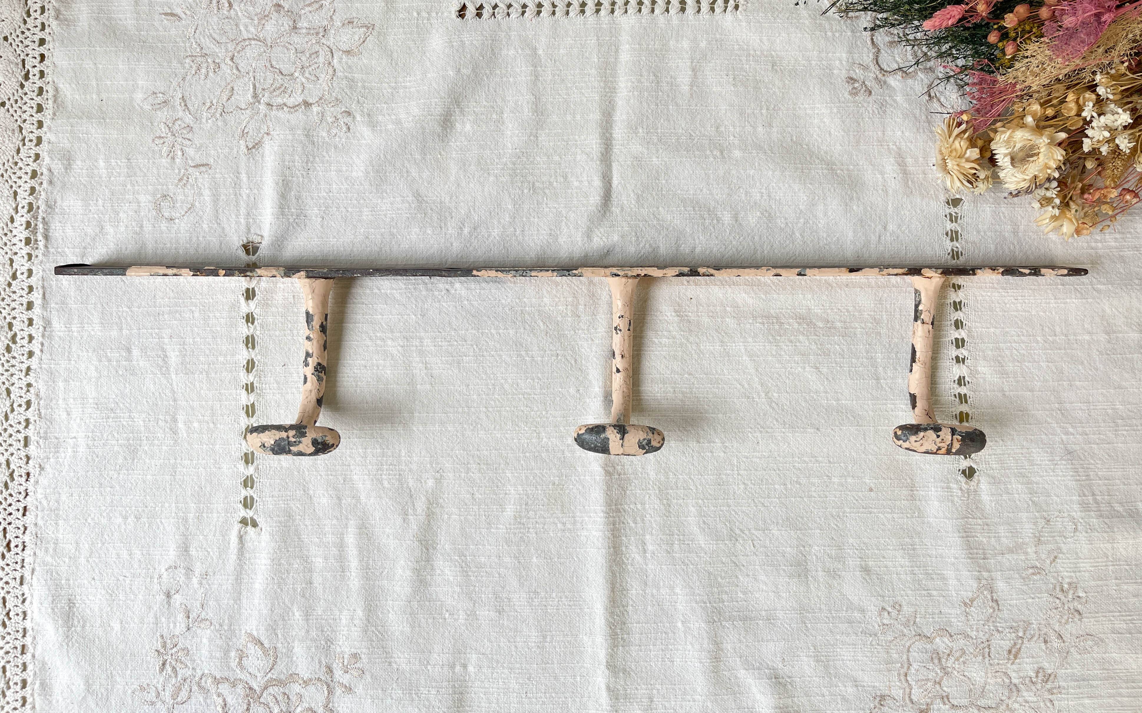 Vintage enameled cast iron wall hook with 3 hooks