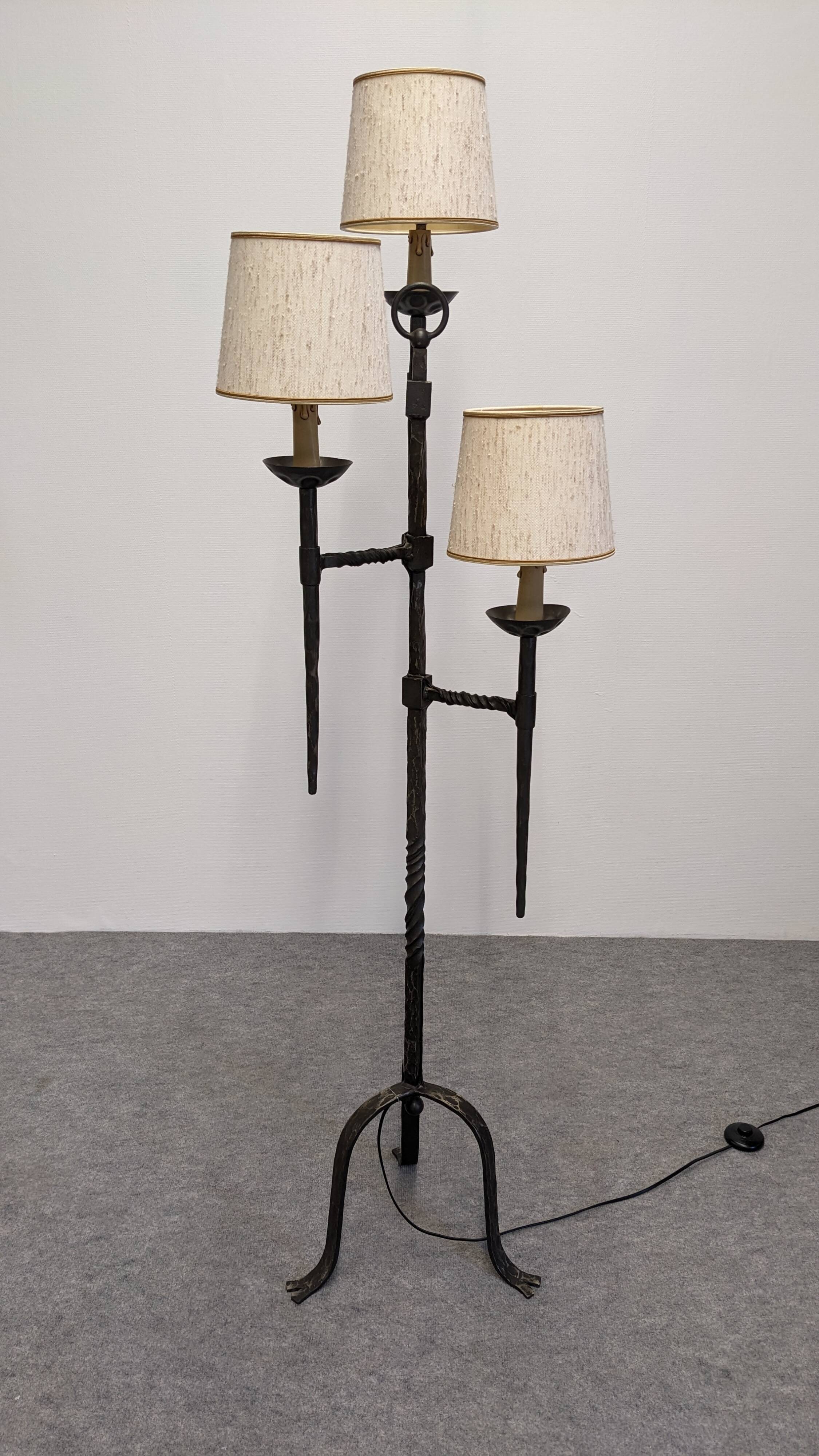 Brutalist tripod floor lamp with 3 lights in wrought iron, France circa 1950.
