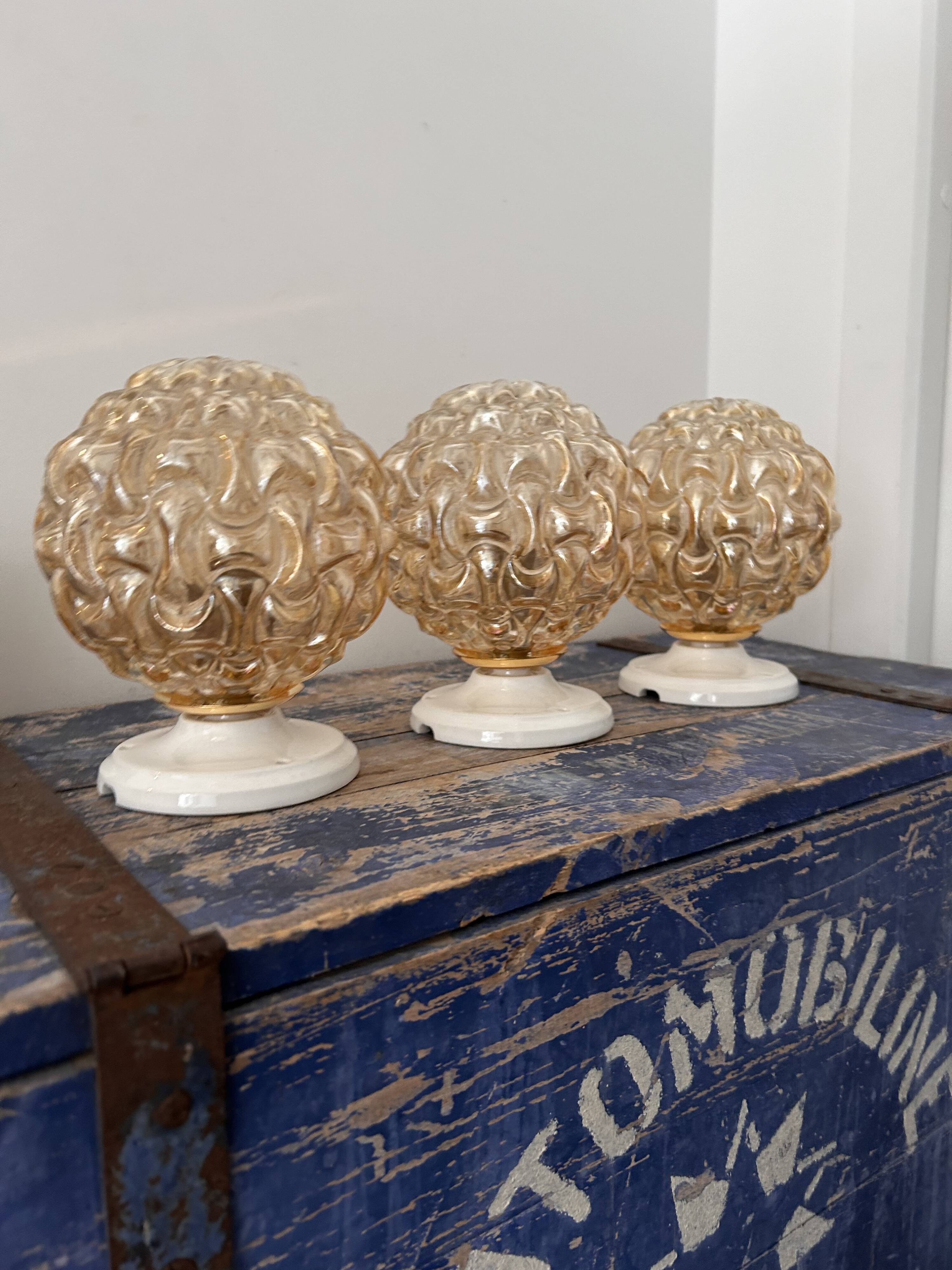 Trio of golden globe wall or ceiling lights