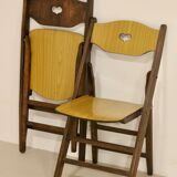 Pair of vintage folding chairs year 50 sculpted backrest.