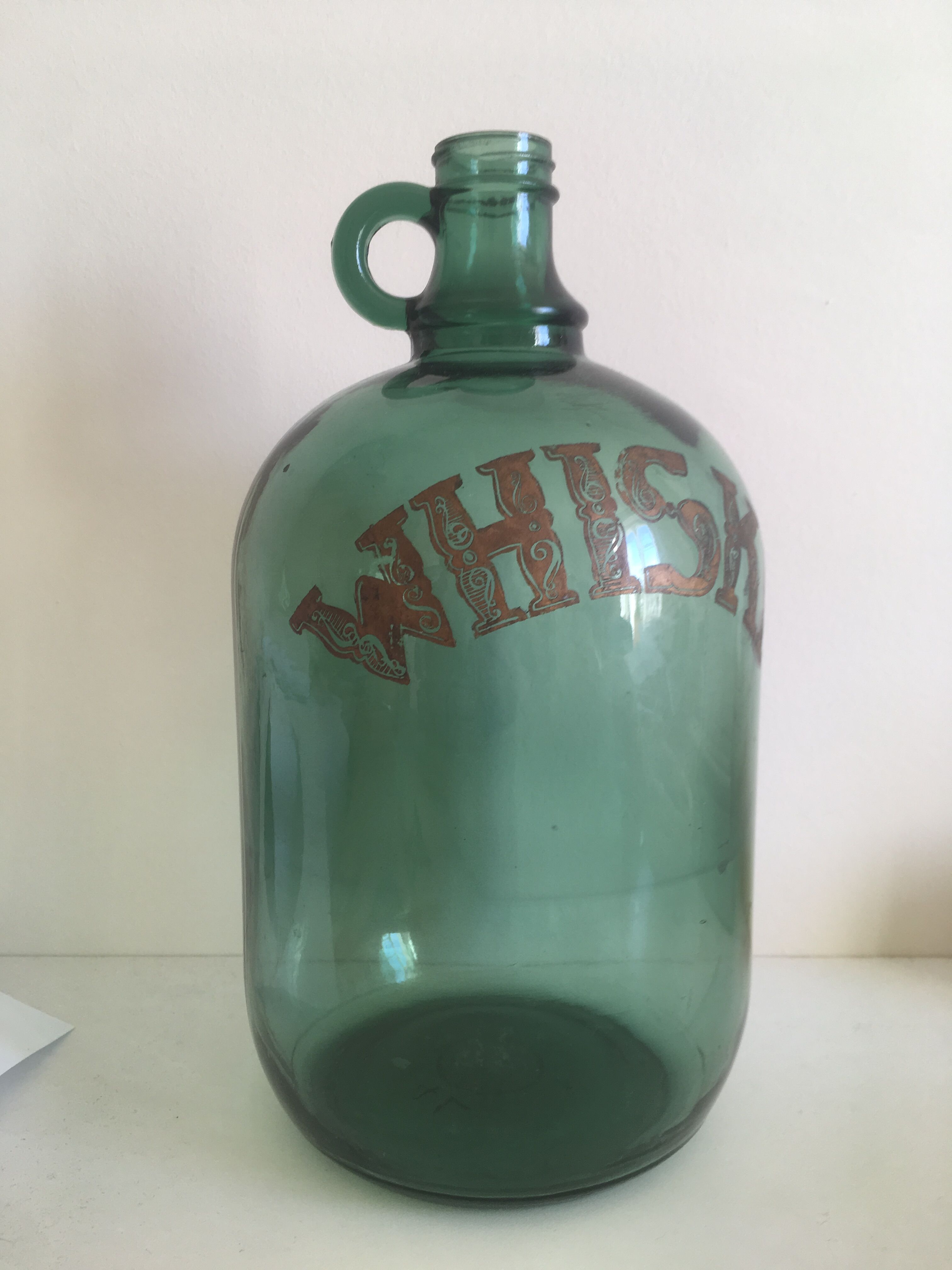 Green glass whiskey bottle