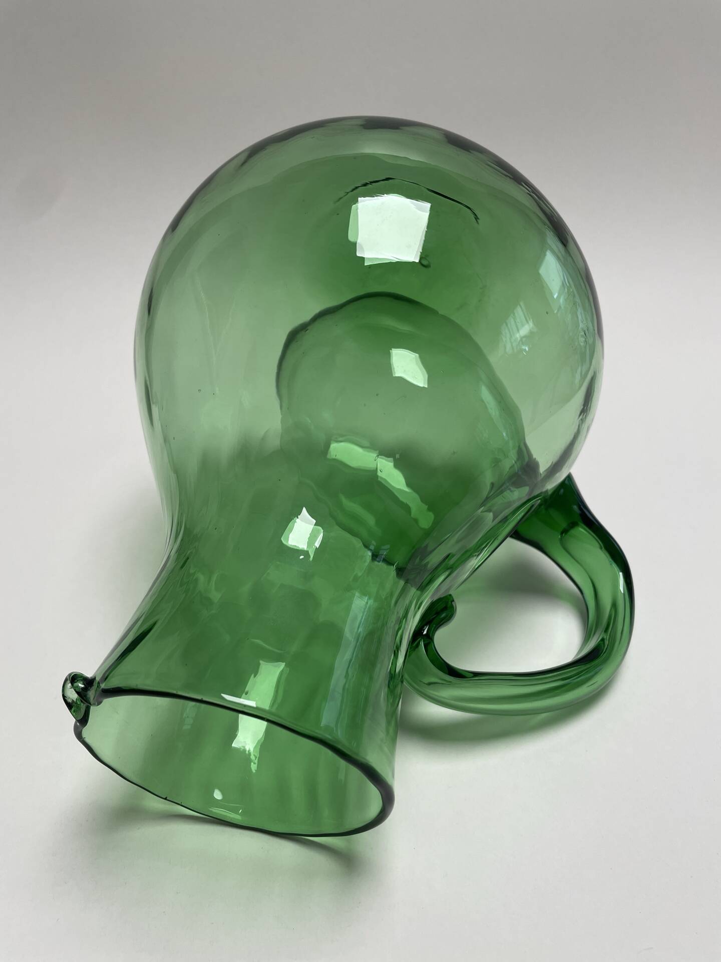 Large green glass cooling jug