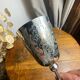 Verre à pied, calice en metal argenté gravé