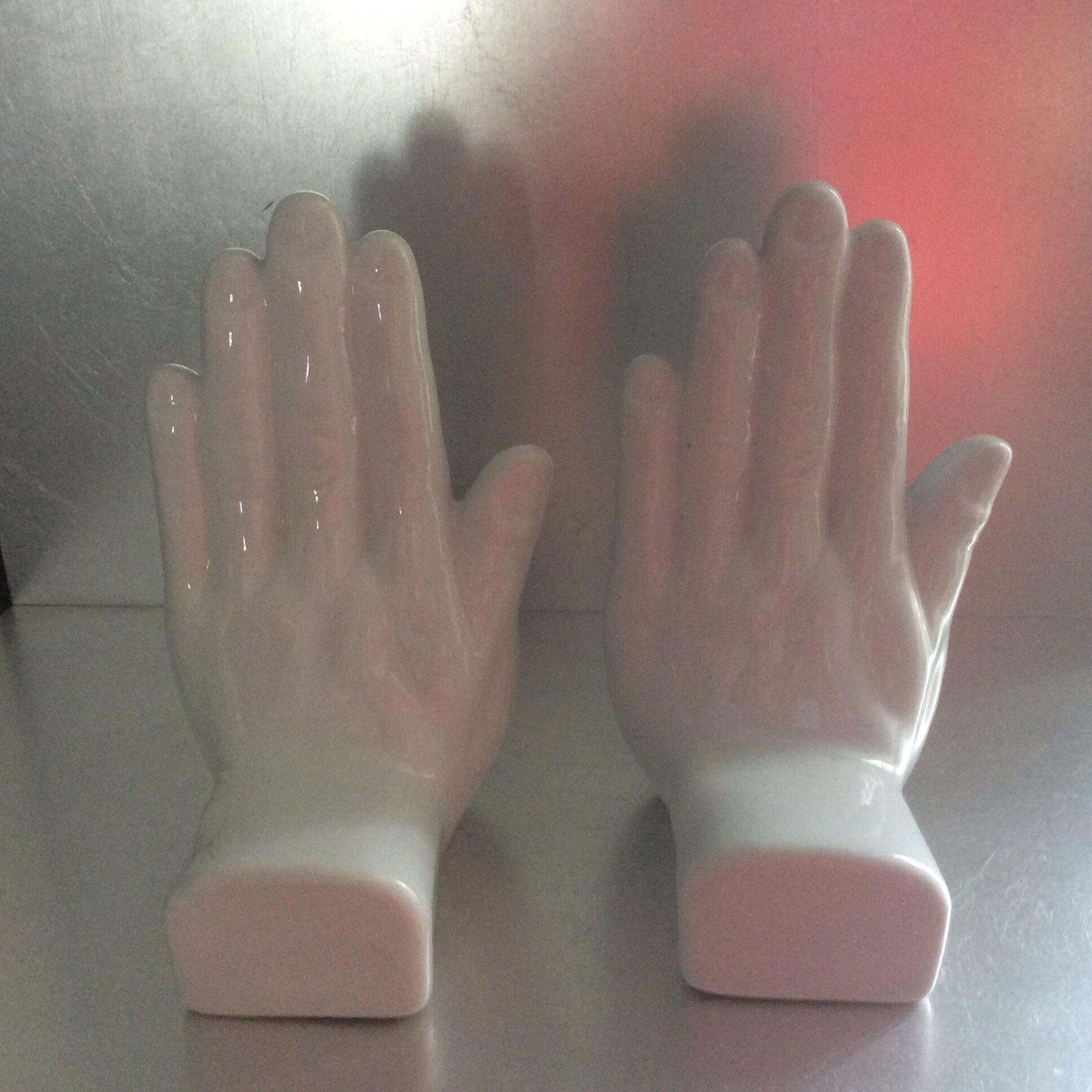 Pair of vintage ceramic handenders