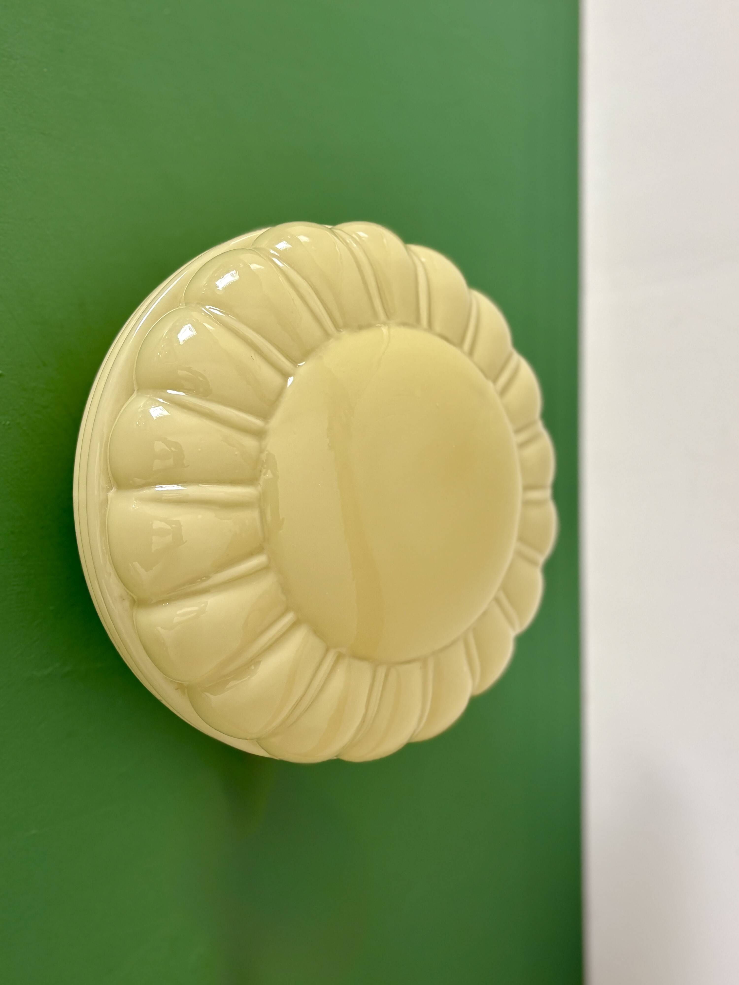 Vintage Art Deco globe wall or ceiling light in yellow opaline.
