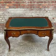 Antique French-style desk with green leather top and bronze mounts