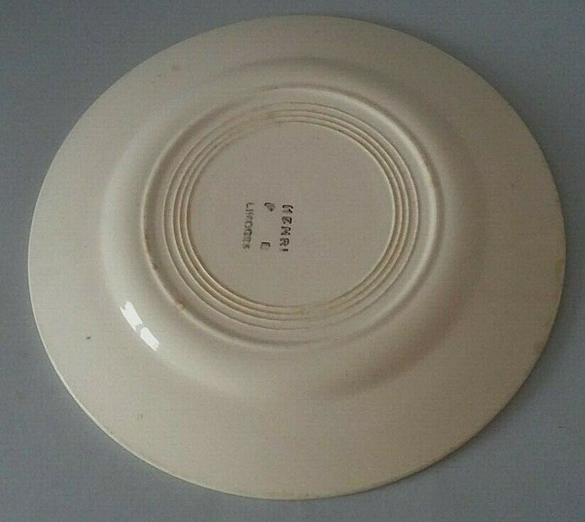 Flat plate in earthenware marked PB Limoges model Henri early XXth