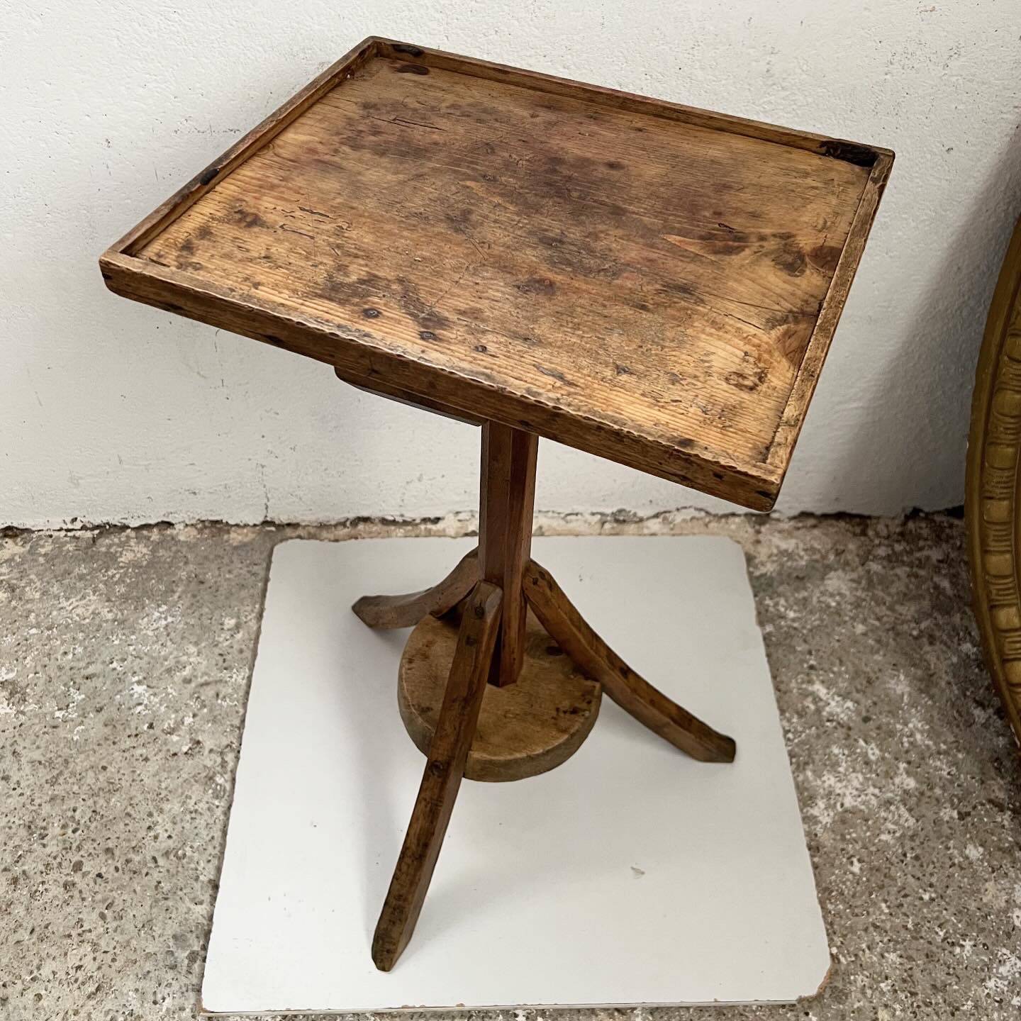 Old primitive wooden tripod pedestal table