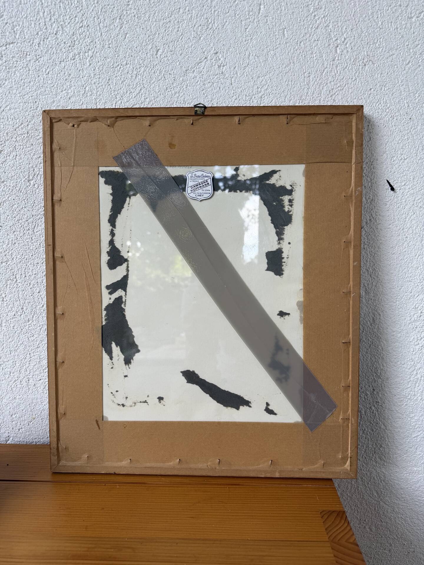 Framed old photo of a mountain landscape.