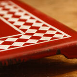 Checkered trivet, enamelled sheet metal