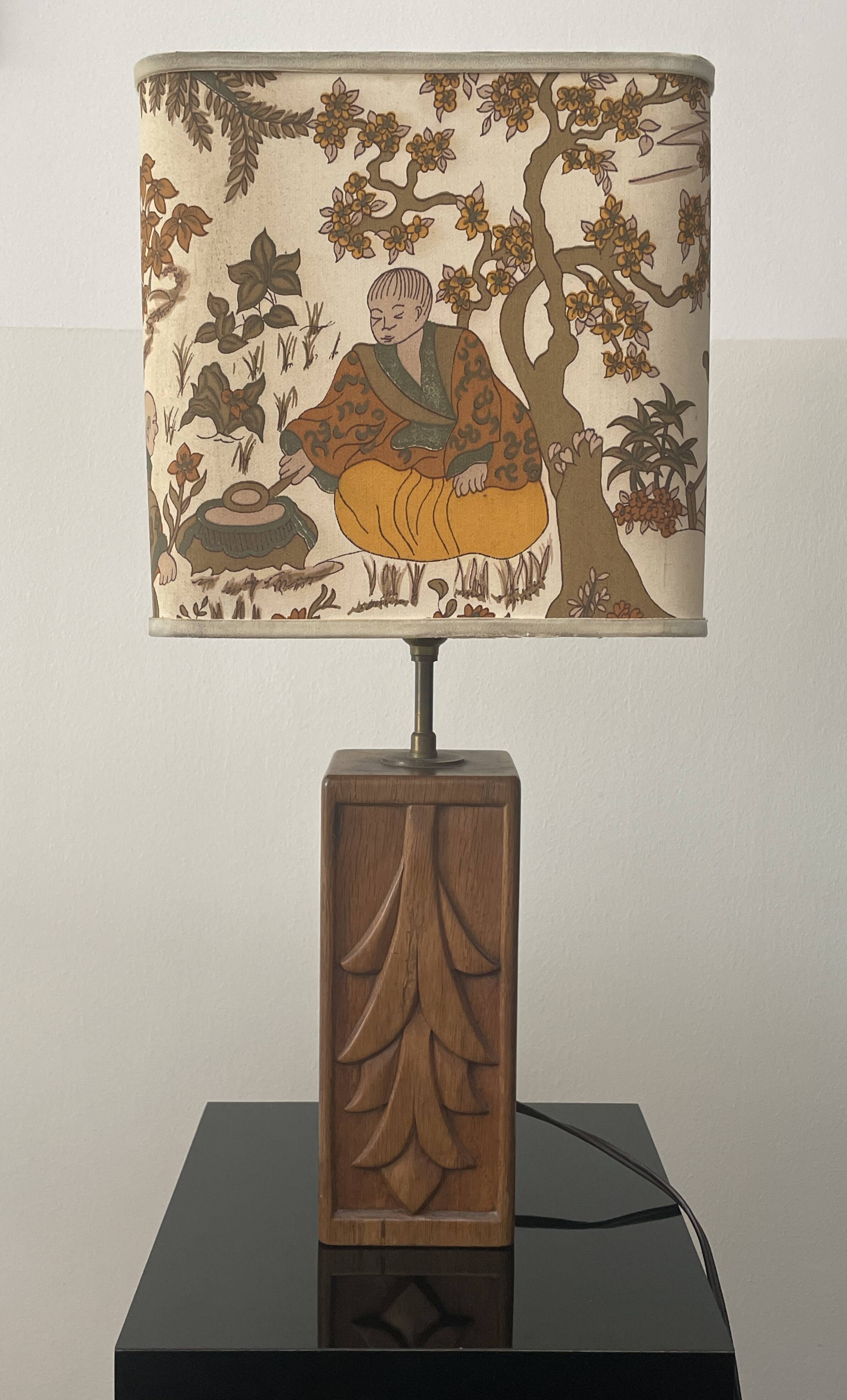 Wooden lamp with carved plant decoration from 1930-50, sold with a 1970 lampshade.