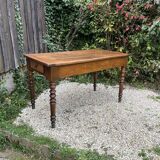 Old kitchen table with chopping board.