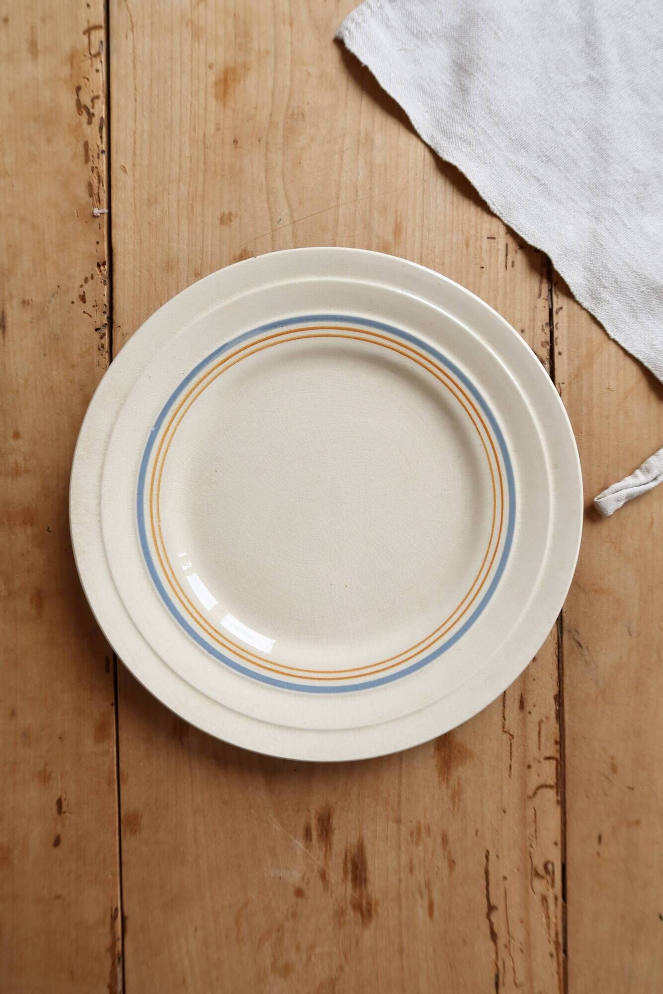Ivory ironstone dessert plate – Pale blue and orange borders