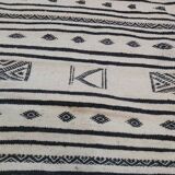 Traditional handmade white and black kilim carpet