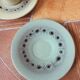 A pair of vintage cups and saucers in glazed stoneware.