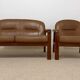Vintage living room set – 2-seater sofa & cognac leather armchair