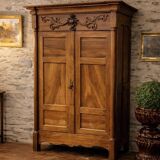 Empire wardrobe in solid walnut, France, mid-19th century.