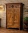 Empire wardrobe in solid walnut, France, mid-19th century.